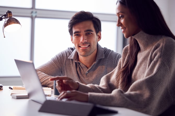 businesswoman-working-on-laptop-at-desk-collaborat-2024-10-20-10-45-54-utc