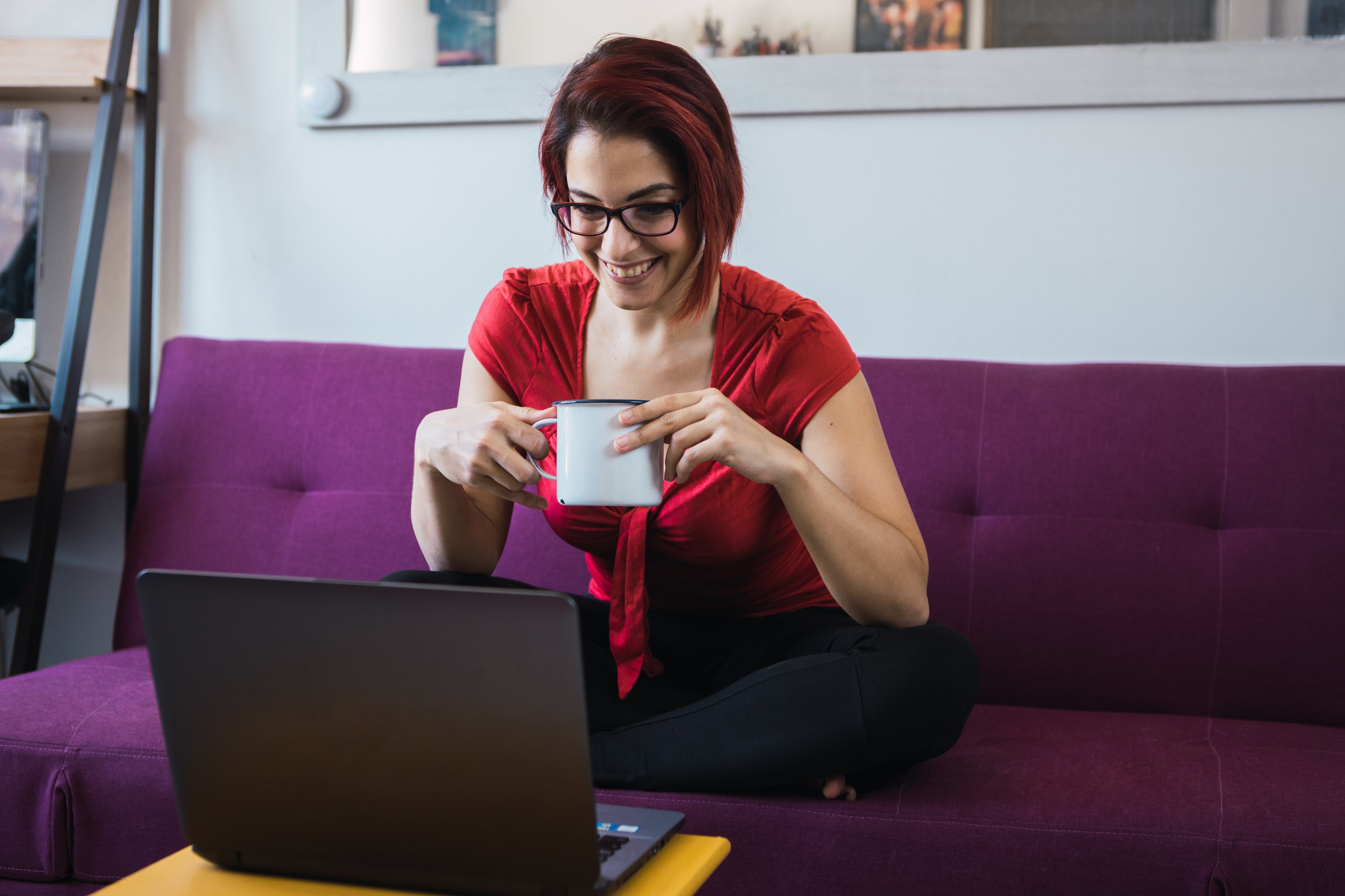 middle-aged-female-sitting-with-a-cup-in-hands-and-2023-11-27-04-49-43-utc