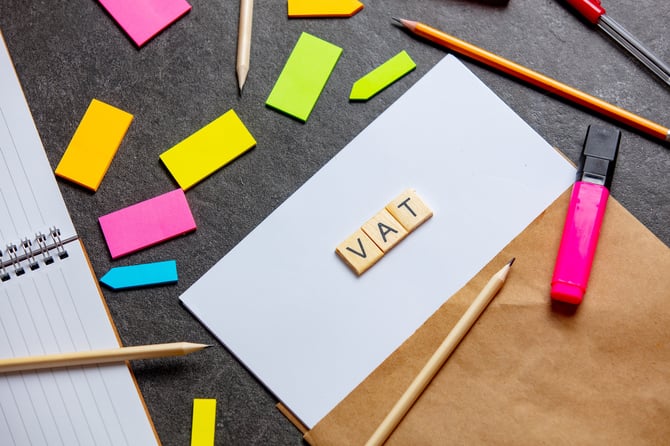 vat-letters-on-paper-sheet-and-notes-around-on-a-t-2024-09-25-06-25-50-utc
